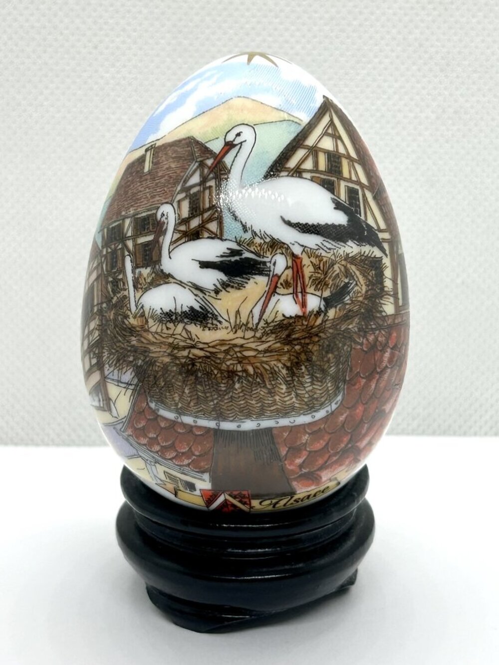 Egg ceramic porcelain decorateed with bird and village artwork, signed by Alsace